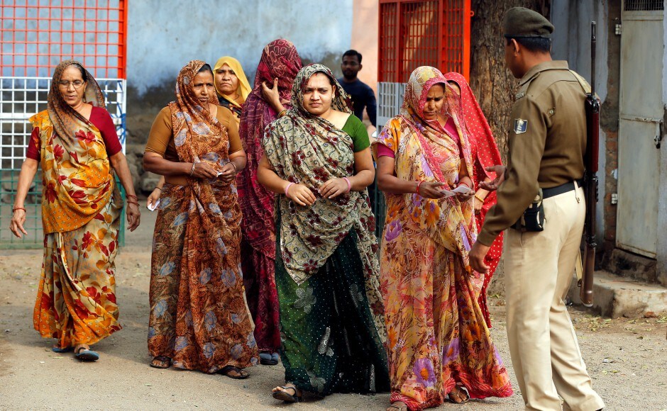 Gujarat chief minister Vijay Rupani appealed to the people to come out to exercise their franchise so as to ensure there is "100 per cent" turnout by the evening. Reuters Gujarat election: People from all walks of life come out to vote in the first phase