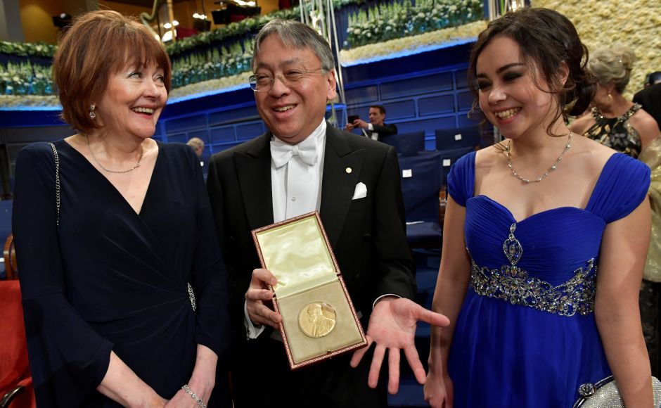 Kazuo Ishiguro poses with his Nobel Prize in literature, flanked by his wife Lorna MacDougall and his daughter Naomi Ishiguro after the Nobel Award Ceremony. Reuters Kazuo Ishiguro, Richard Thaler and other 2017 Nobel Prize winners attend award ceremony in Stockholm