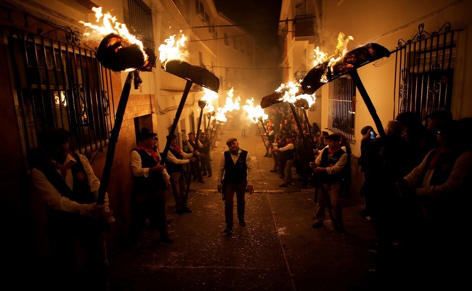Villagers hold torches to represent light and vision during the Divina Pastora procession, as part of a festival to honour the Virgin of Los Rondeles, on the eve of St. Lucia's Day, in Casarabonela, near Malaga, southern Spain. REUTERS Villagers hold torches to represent light and vision during the Divina Pastora procession, as part of a festival to honour the Virgin of Los Rondeles, on the eve of St. Lucia's Day, in Casarabonela, near Malaga, southern Spain. REUTERS