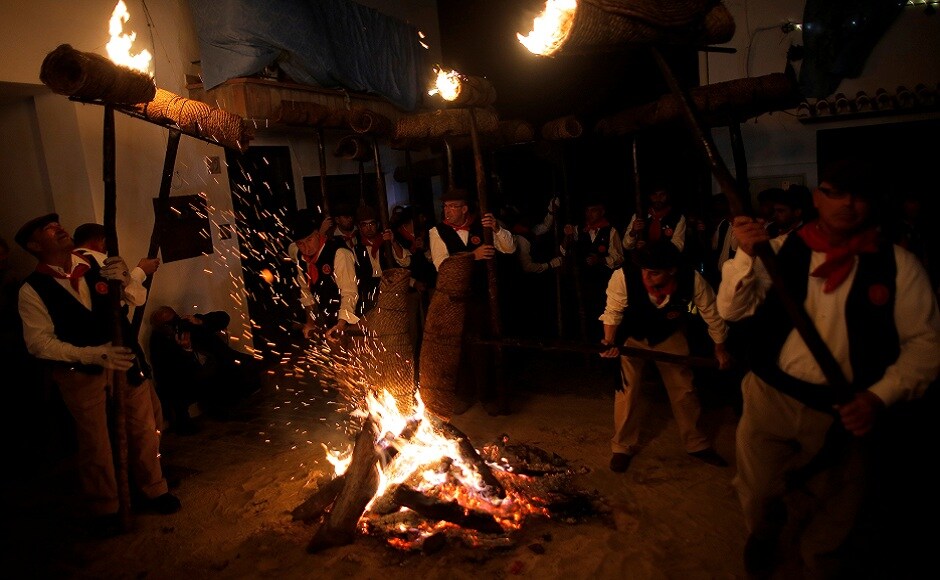 Villagers hold torches to represent light and vision during the Divina Pastora procession, as part of a festival to honour the Virgin of Los Rondeles, on the eve of St Lucia's Day, in Casarabonela, near Malaga, southern Spain. REUTERS Villagers hold torches to represent light and vision during the Divina Pastora procession, as part of a festival to honour the Virgin of Los Rondeles, on the eve of St Lucia's Day, in Casarabonela, near Malaga, southern Spain. REUTERS
