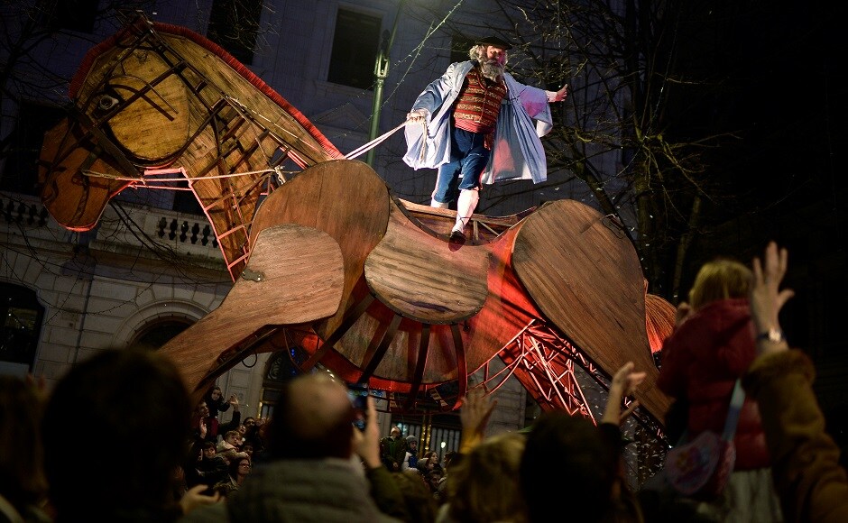 The Olentzero, a horse riding coal man similar to Santa Claus in Basque culture, waves to children during a parade in Bilbao, Spain. REUTERS Christmas around the world: Lights, Santa hats and good cheer mark festivities
