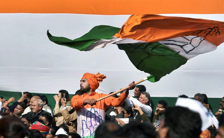 A party worker celebrates during the elevation ceremony Rahul Gandhi at AICC headquarters. Gandhi takes over the reins from mother Sonia 19 years after she took over the party in 1998. A party worker celebrates during the elevation ceremony Rahul Gandhi at AICC headquarters. Gandhi takes over the reins from mother Sonia 19 years after she took over the party in 1998.
