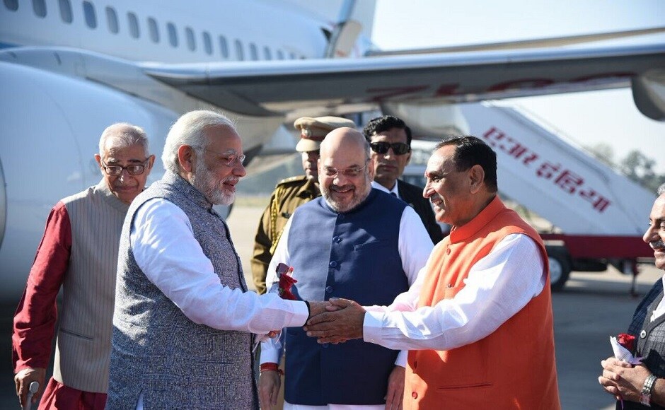 Prime Minister Narendra Modi arrived in Gujarat on Tuesday to attend the oath-taking ceremony of the new government in Gujarat. He was received by BJP chief Amit Shah and Vijay Rupani at the airport. Twitter @BJP4Gujarat Narendra Modi in Gujarat to attend Vijay Rupani's oath-taking ceremony, receives grand welcome