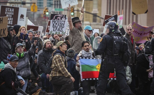 Roughly 3,000 demonstrators lined up near the State Capitol to protest Trump's announcement. Some held signs that said, "Keep your tiny hands off our public lands," and they chanted, "Lock him up!" A smaller group gathered in support, including some who said they favour potential drilling or mining there that could create jobs. AP Roughly 3,000 demonstrators lined up near the State Capitol to protest Trump's announcement. Some held signs that said, "Keep your tiny hands off our public lands," and they chanted, "Lock him up!" A smaller group gathered in support, including some who said they favour potential drilling or mining there that could create jobs. AP