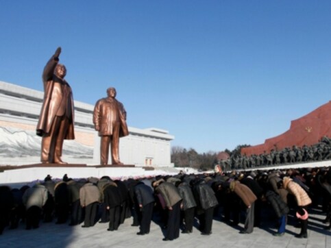 North Koreans pay tribute to Kim Jong II on his sixth death anniversary, march towards Mansu hill monument North Koreans pay tribute to Kim Jong II on his sixth death anniversary, march towards Mansu hill monument