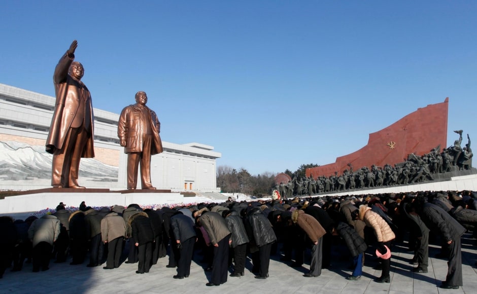 Thousands of North Koreans marched up Pyongyang's Mansu Hill to bow and place flowers at the feet of two giant bronze statues of Kim Jong II and national founder Kim II Sung. AP Thousands of North Koreans marched up Pyongyang's Mansu Hill to bow and place flowers at the feet of two giant bronze statues of Kim Jong II and national founder Kim II Sung. AP