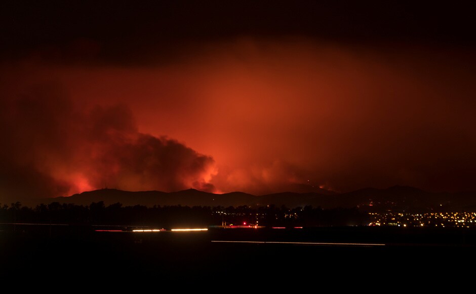 Firefighters were providing structure protection as helicopters flying in darkness made water drops on the flames on the east side of the pass. Northbound traffic was halted, but southbound lanes remained open. Reuters Firefighters were providing structure protection as helicopters flying in darkness made water drops on the flames on the east side of the pass. Northbound traffic was halted, but southbound lanes remained open. Reuters