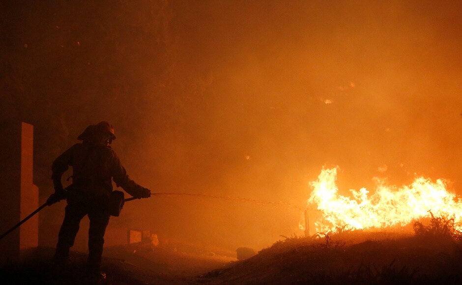 Firefighters puts out a spot fire during the Creek Fire in the San Fernando Valley north of Los Angeles, in Sylmar. Reuters Firefighters puts out a spot fire during the Creek Fire in the San Fernando Valley north of Los Angeles, in Sylmar. Reuters