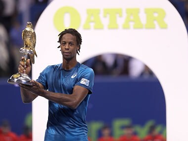 Gael Monfils of France holds the winner's trophy after winning against Russia's Andrey Rublev in the ATP Qatar Open tennis competition in Doha on January 6, 2018. Monfils won the Qatar Open final in straight sets, brushing aside Rublev in a one-sided final, 6-2, 6-3. / AFP PHOTO / KARIM JAAFAR