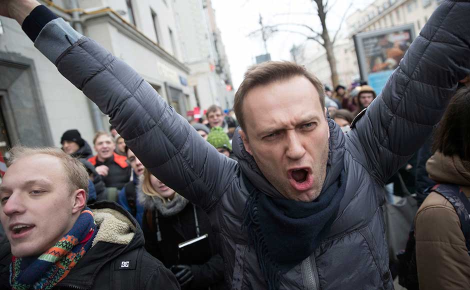 Navalny, who has been blocked from running in Russia's 18 March presidential election, called for nationwide protests on Sunday. AP Navalny, who has been blocked from running in Russia's 18 March presidential election, called for nationwide protests on Sunday. AP