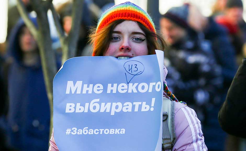 Navalny rose to prominence with detailed reports about corruption among top Russian officials, which he popularised on social media to circumvent state control of the television. A demonstrator holds a poster which reads "I have no one to choose!! Strike." during a rally in Vladivostok. AP Navalny rose to prominence with detailed reports about corruption among top Russian officials, which he popularised on social media to circumvent state control of the television. A demonstrator holds a poster which reads "I have no one to choose!! Strike." during a rally in Vladivostok. AP