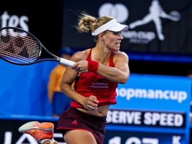 Angelique Kerber of Germany hits a return against Thanasi Kokkinakis of Australia during their twelfth session mixed doubles match on day seven of the Hopman Cup. AFP