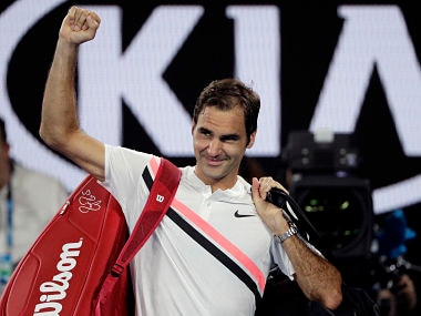 Switzerland's Roger Federer waves as he leaves Rod Laver Arena following South Korea's Hyeon Chung's retirement from their semifinal at the Australian Open tennis championships in Melbourne, Australia, Friday, Jan. 26, 2018. (AP Photo/Dita Alangkara)