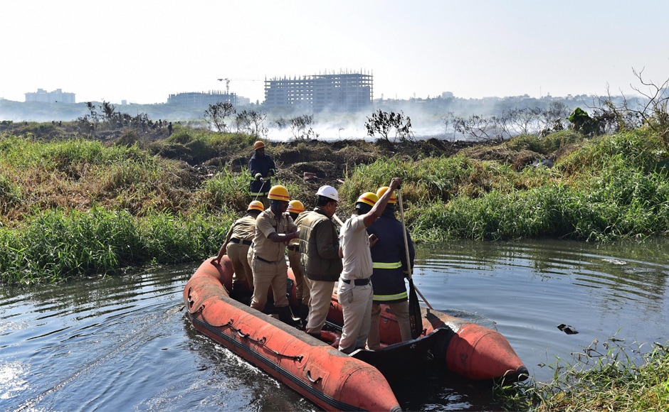 Firefighters inspect Bellandur lake on Saturday. Bengaluru mayor R Sampath Raj said the fire seems to be an outcome of the accumulation of chemicals. PTI Firefighters inspect Bellandur lake on Saturday. Bengaluru mayor R Sampath Raj said the fire seems to be an outcome of the accumulation of chemicals. PTI