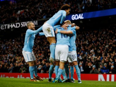 Manchester City's Sergio Aguero celebrates scoring their second goal with teammates. Reuters