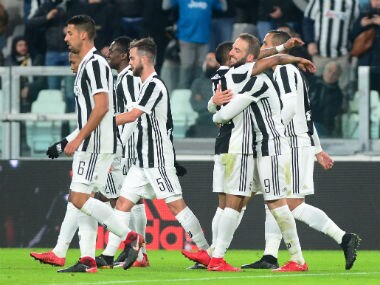 Juventus’ Douglas Costa celebrates scoring their first goal with Gonzalo Higuain and teammates. Reuters