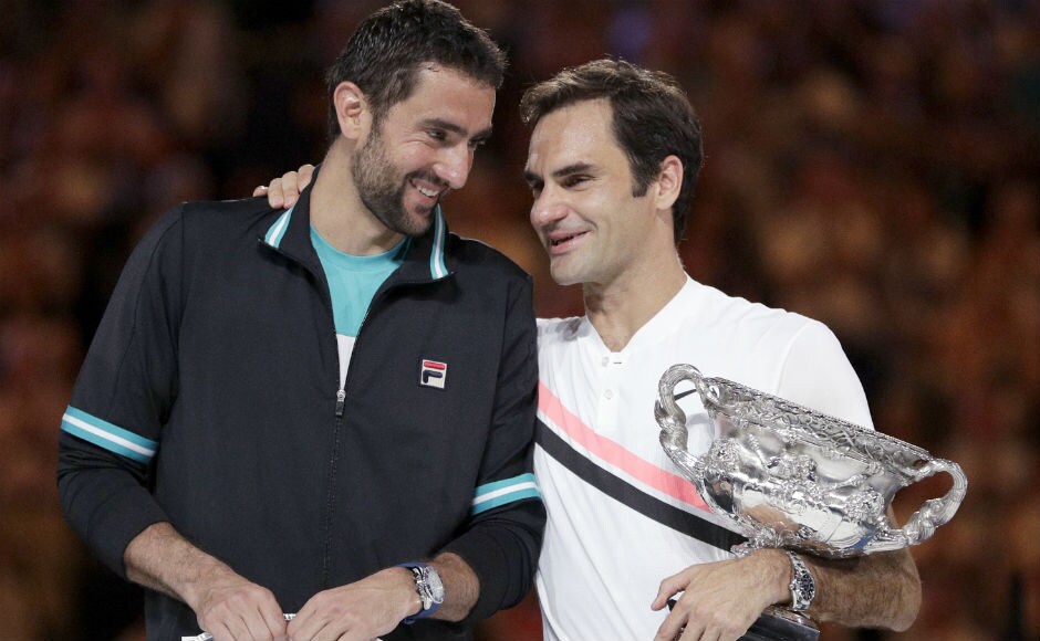 Switzerland's Roger Federer, right, talks with Croatia's Marin Cilic after winning the men's singles final. AP Switzerland's Roger Federer, right, talks with Croatia's Marin Cilic after winning the men's singles final. AP
