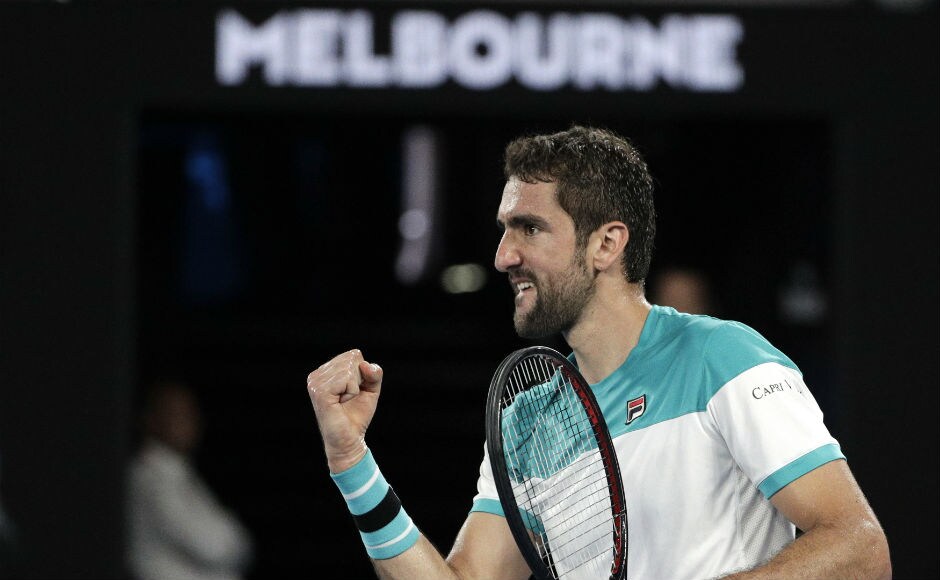 Croatia's Marin Cilic reacts after winning the fourth set 6-3 against Roger Federer. This match is going down the wire. AP Croatia's Marin Cilic reacts after winning the fourth set 6-3 against Roger Federer. This match is going down the wire. AP