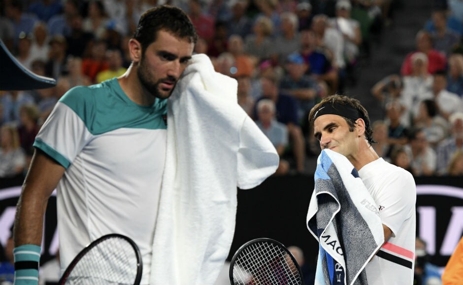 Switzerland's Roger Federer, right, walks past Croatia's Marin Cilic during a change of ends. It's one set apiece in the men's singles final at the Rod Laver Arena. AP Switzerland's Roger Federer, right, walks past Croatia's Marin Cilic during a change of ends. It's one set apiece in the men's singles final at the Rod Laver Arena. AP
