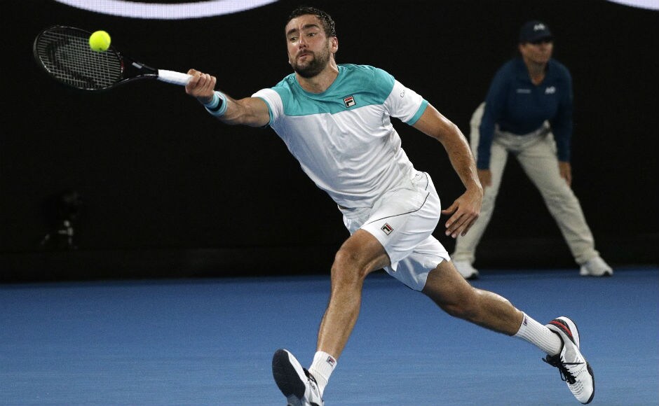 Marin Cilic runs to make a forehand return to Switzerland's Roger Federer in opening set of the men's singles final. AP Marin Cilic runs to make a forehand return to Switzerland's Roger Federer in opening set of the men's singles final. AP