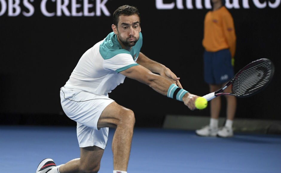 Marin Cilic hits a backhand to Switzerland's Roger Federer. The Croat leads 5-3 in the fourth set after losing the third. AP Marin Cilic hits a backhand to Switzerland's Roger Federer. The Croat leads 5-3 in the fourth set after losing the third. AP