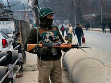 A security personnel stands guard in Srinagar on Tuesday. PTI