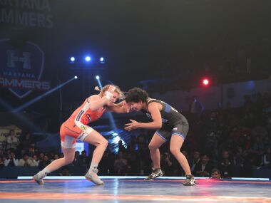 Punjab Royals' Pooja Dhanda (black) engage in a tussle against Haryana Hammers' Helen Maroulis (orange). PWL