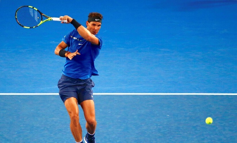 Tennis - Australian Open - Melbourne Park, Melbourne, Australia, January 12, 2018. Spain's Rafael Nadal runs to hit a shot during a practice match with Austria's Dominic Thiem ahead of the Australian Open tennis tournament. REUTERS/David Gray - RC191BBEB0D0