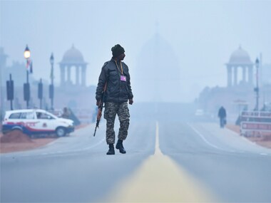 Paramilitary soldiers stand guard at Rajpath ahead of Republic Day parade in New Delhi on Wednesday. PTI