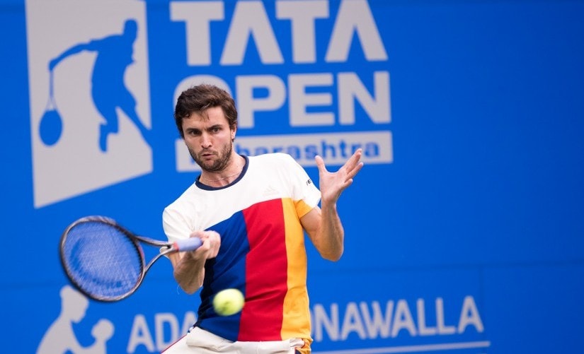 Gilles Simon returns a shot to Marin Cilic in their semi-final match. Maharashtra Open