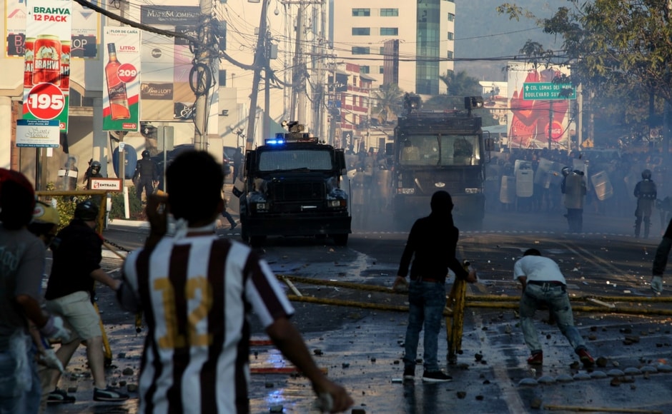 Thousands of demonstrators led by Opposition leader Salvador Nasralla gathered in Honduras' second-largest city on Friday to protest the re-election of President Juan Orlando Hernandez in a vote they say was fraudulent. AP Protests against Honduran president Juan Orlando Hernandez's re-election turn violent