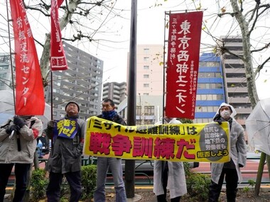 The first evacuation drill was conducted in central Tokyo Monday morning amid rising fear that a North Korean ballistic missile could hit Japanese soil. AP