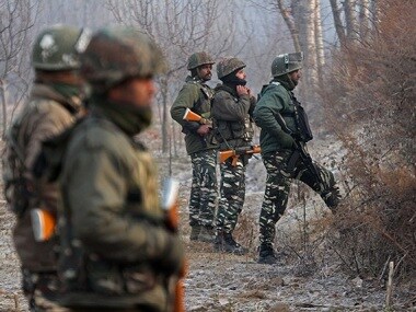 CRPF soldiers patrol the boundary of the CTC as the militants engage their colleagues inside the training centre. Firstpost/Faisal Khan