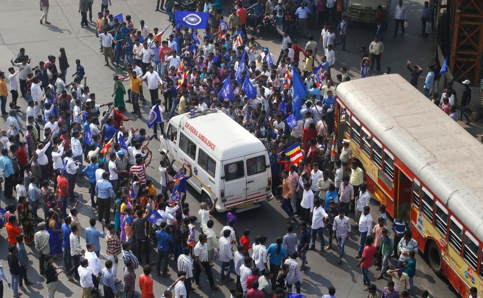Normal life in Mumbai was disrupted as protesters attacked city buses, stopped suburban local services and blocked roads at various places in the city. In view of protests in the city and suburbs, police diverted traffic for smooth vehicular movement. PTI Normal life in Mumbai was disrupted as protesters attacked city buses, stopped suburban local services and blocked roads at various places in the city. In view of protests in the city and suburbs, police diverted traffic for smooth vehicular movement. PTI