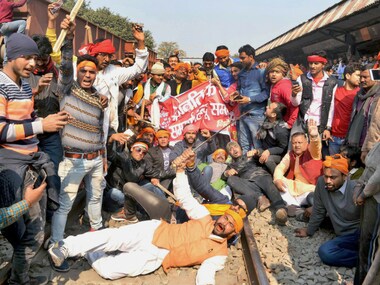 A group of protesters stop a train during a protest against the release of film 'Padmaavat' at Motihari in Bihar on Thursday. PTI