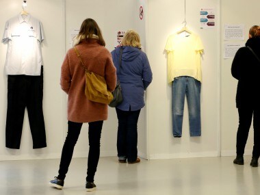 Visitors are seen at the exhibition "What Were You Wearing?" that showcases the stories of U.S. student rape victims through representations of the outfits they wore during their assault. Reuters