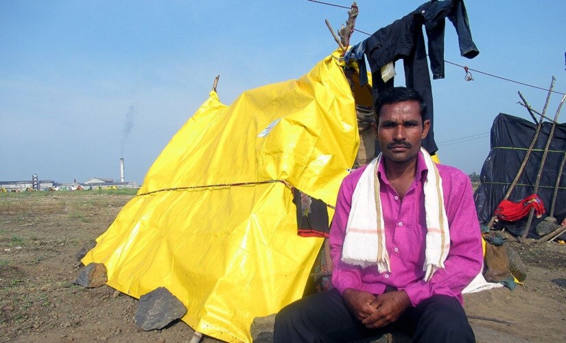 Vishnu Pawar and his family have made a makeshift tent just outside Belgaum city, where they work in the merciless cane fields. Image courtesy Parth MN