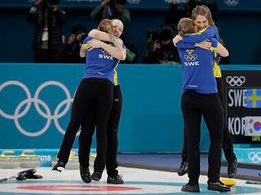 Sweden celebrates after winning the gold medal in their women's curling final in the Gangneung Curling Centre at the 2018 Winter Olympics in Gangneung, South Korea, Sunday, Feb. 25, 2018. (AP Photo/Aaron Favila)