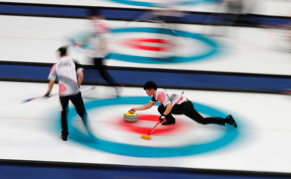 South Korea deliver a stone during the men's round robin against South Korea. Reuters Michela Moioli, Frida Hansdotter among gold medallists on Day 7 of Winter Olympics