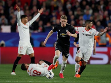 Manchester United's Scott McTominay is in action while Sevilla’s Ever Banega and Joaquin Correa react as Sergio Escudero is on the floor. Reuters