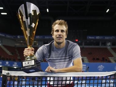 Mirza Basic poses with the winner's trophy. Image courtesy: Twitter/@sofiaopentennis