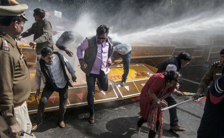 The BJP staged a protest outside Kejriwal's residence accusing his government of pushing the city 30 years behind in three years of its rule. The Delhi Police use mild force and water cannons, injuring several BJP workers. The BJP staged a protest outside Kejriwal's residence accusing his government of pushing the city 30 years behind in three years of its rule. The Delhi Police use mild force and water cannons, injuring several BJP workers.