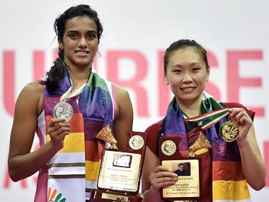 New Delhi: India's P V Sindhu and Beiwen Zhang (USA) pose for a picture with their medals after the women singles final match of the Yonex-Sunrise India Open 2018 in New Delhi on Sunday. Beiwen Zhang (USA) won the match by 21-18,11 -21, 22 - 20 . PTI Photo by Arun Sharma(PTI2_4_2018_000187B) *** Local Caption ***