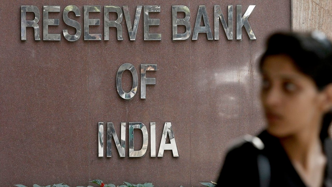A woman walks past the Reserve Bank of India building in New Delhi