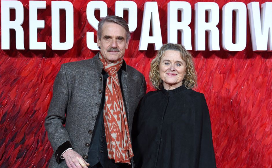 English actor Jeremy Irons (L) and Irish actress Sinead Cusack pose on the red carpet on arrival to attend the European premiere of the film Red Sparrow. AFP English actor Jeremy Irons (L) and Irish actress Sinead Cusack pose on the red carpet on arrival to attend the European premiere of the film Red Sparrow. AFP