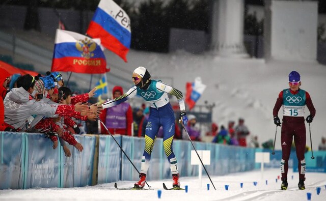 Stina Nilsson of Sweden celebrates after the women's sprint classi final in cross-country skiing race next to Olympic Athlete from Russia Yulia Belorukova. Reuters Stina Nilsson of Sweden celebrates after the women's sprint classi final in cross-country skiing race next to Olympic Athlete from Russia Yulia Belorukova. Reuters