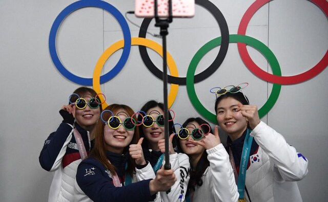 South Korea's short track relay gold medallists Shim Sukhee, Choi Minjeong, Kim Yejin, Kim Alang and Lee Yubin pose for a selfie with their medals in front of Olympic rings. AFP South Korea's short track relay gold medallists Shim Sukhee, Choi Minjeong, Kim Yejin, Kim Alang and Lee Yubin pose for a selfie with their medals in front of Olympic rings. AFP