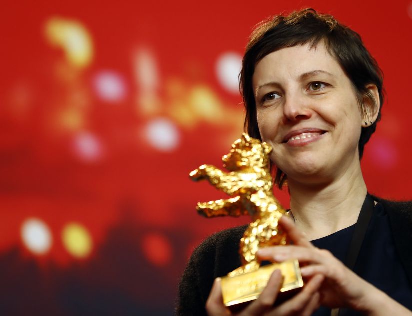 Director, screenwriter, editor and producer Adina Pintilie poses with her Golden Bear award for Best Film Touch Me Not at the news conference after the awards ceremony at the 68th Berlinale International Film Festival in Berlin, Germany, February 24, 2018. REUTERS/Fabrizio Bensch - UP1EE2O1MXG7G
