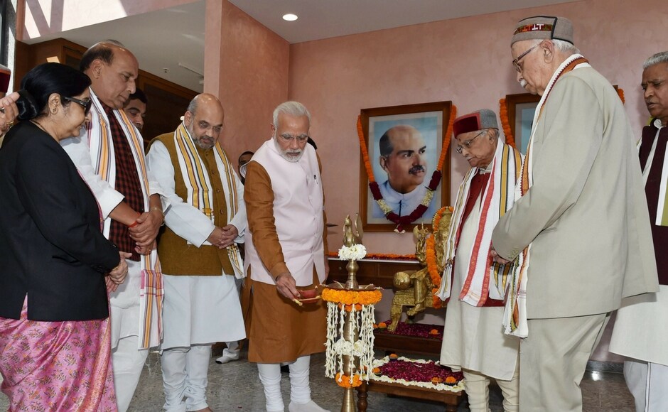 Prime Minister Narendra Modi on Sunday inaugurated the BJP's new headquarters in the New Delhi at 6, Deen Dayal Upadhyaya Marg, in the presence of veteran leaders like LK Advani and Murli Manohar Joshi. PTI Narendra Modi inaugurates new BJP headquarters in New Delhi; LK Advani, Murli Manohar Joshi attend event