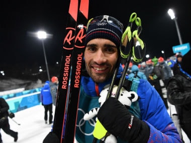 France's Martin Fourcade smiles after the men's biathlon pursuit event during the Winter Olympics 2018. AFP